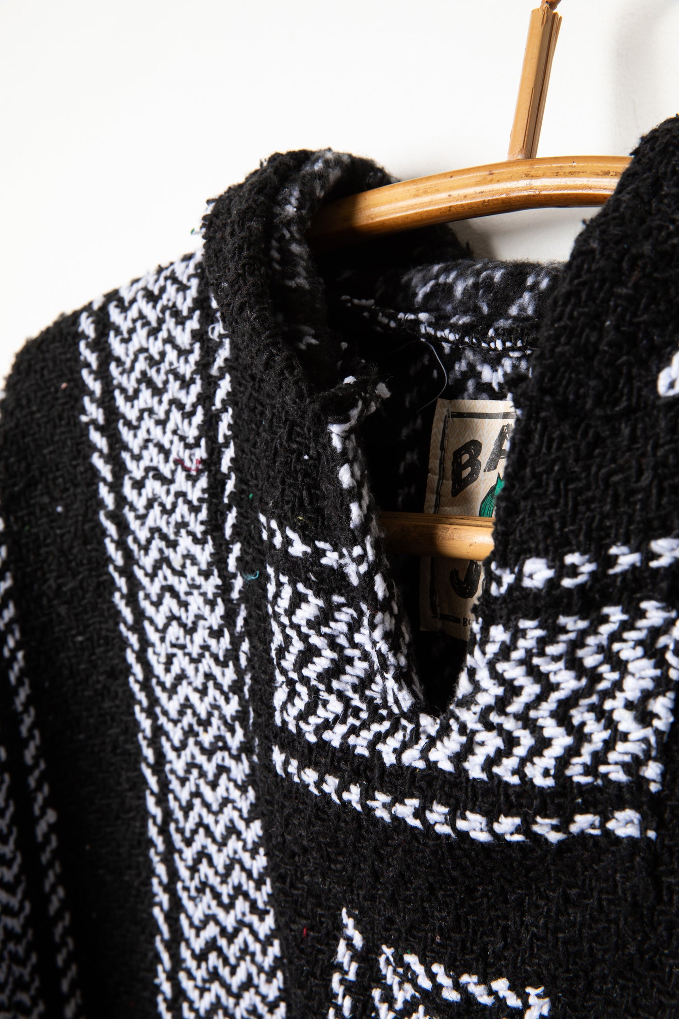 Recycled baja hoodie in Black detail of collar