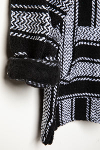 Recycled baja hoodie in Black detail of sleeve