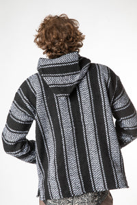 Ryan is wearing size L baja hoodie in black