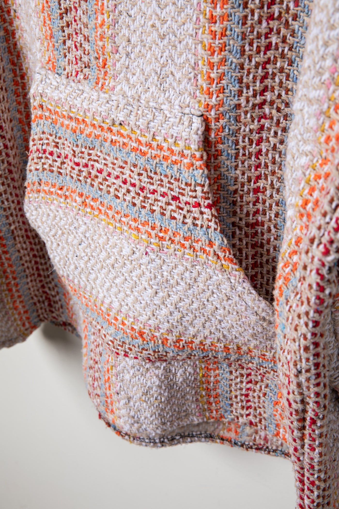 Recycled baja hoodie in Cayenne detail of kangaroo pouch