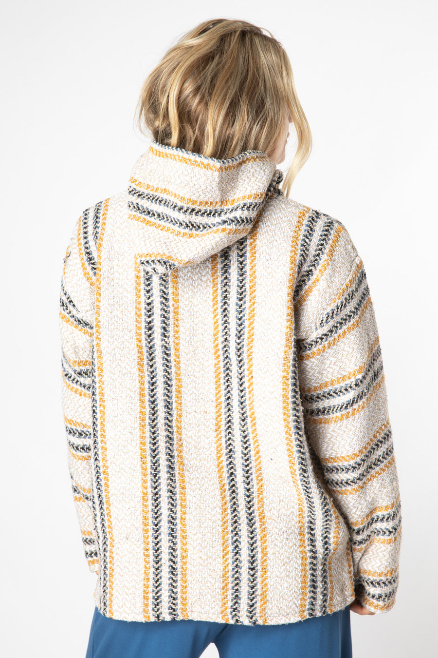 Sophie is wearing size M baja hoodie in mustard