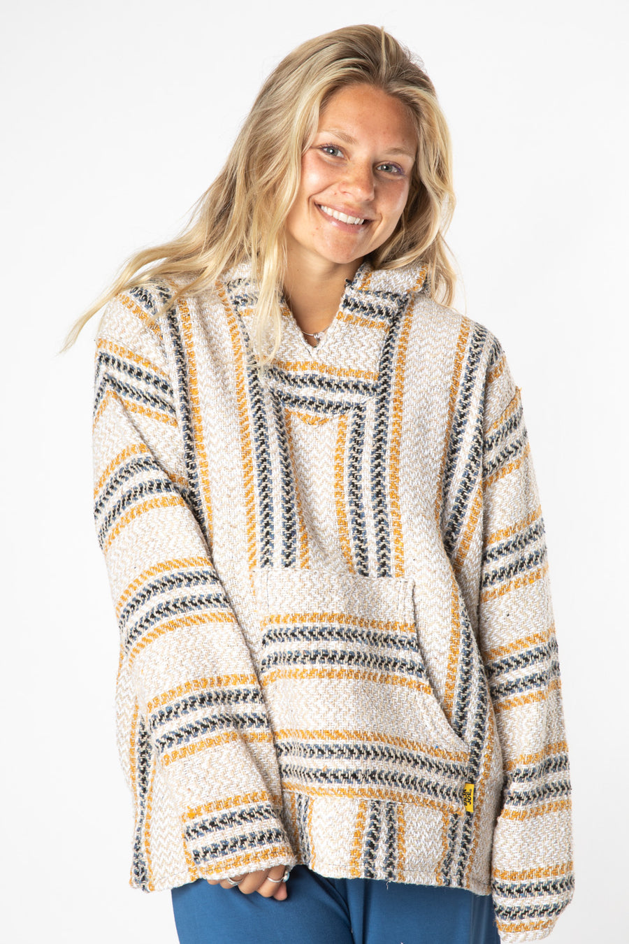 Sophie is wearing size M baja hoodie in mustard