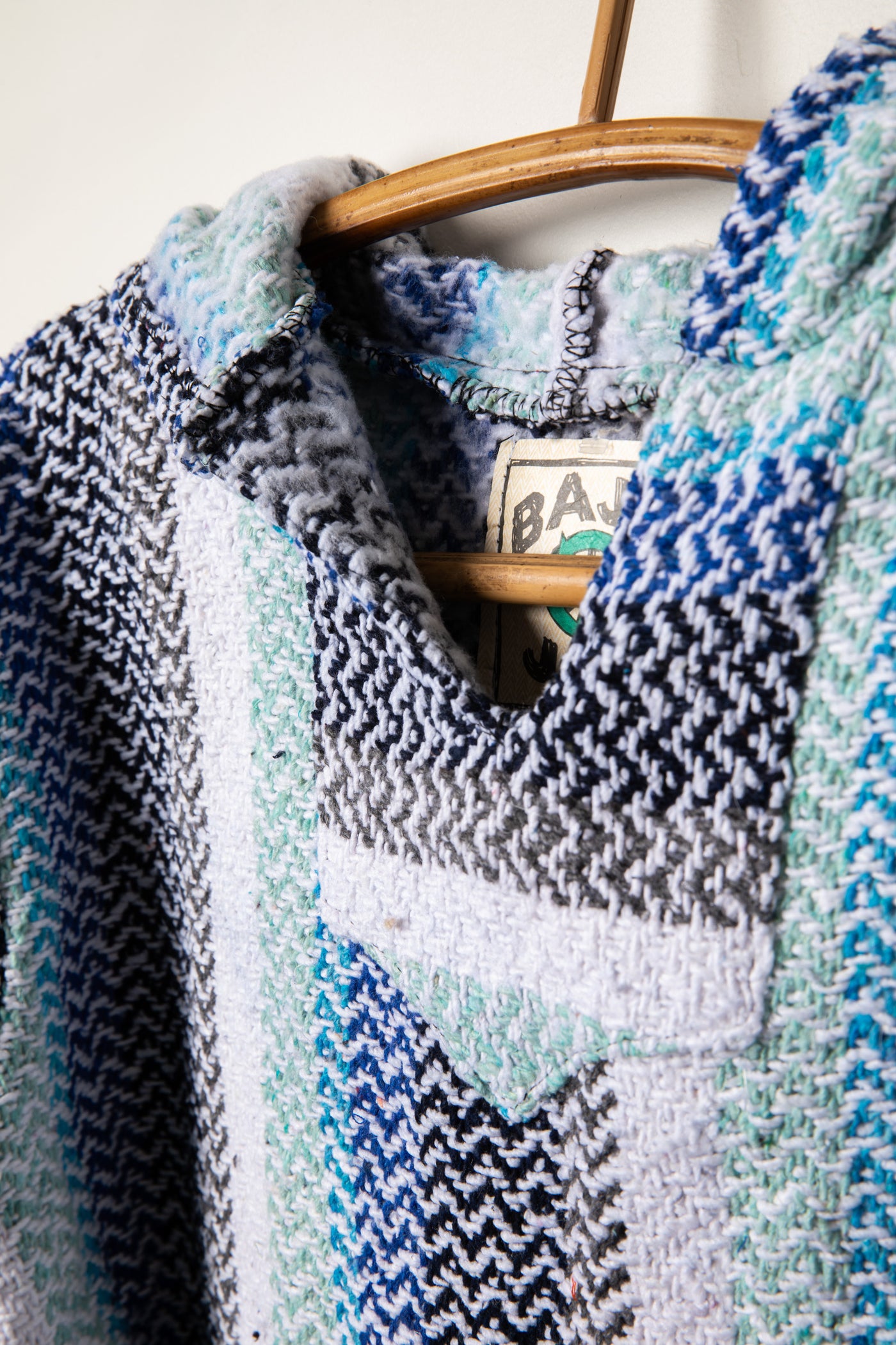 Recycled baja hoodie in pistachio detail of collar
