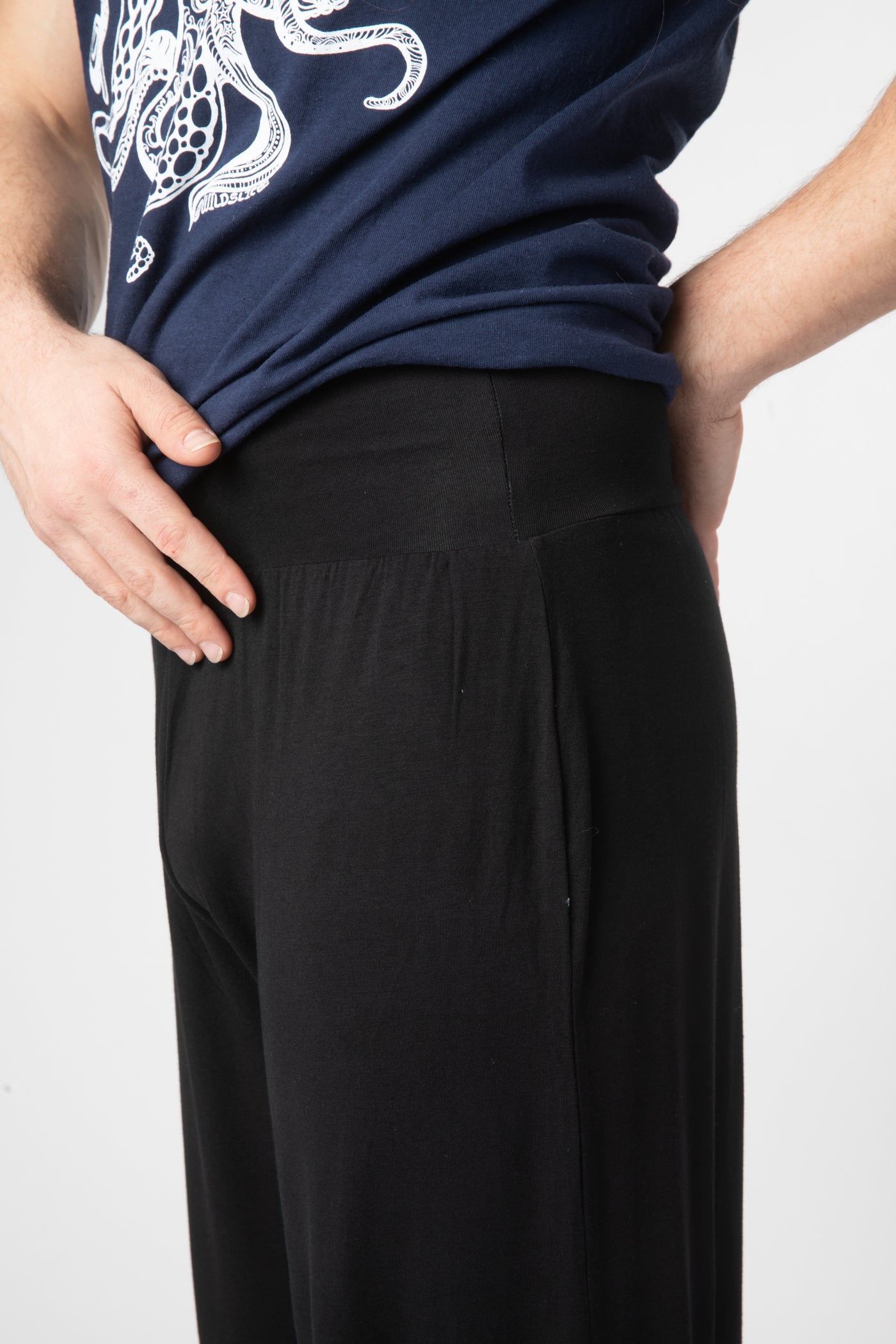 Zachariah is wearing size XL harem pants in black