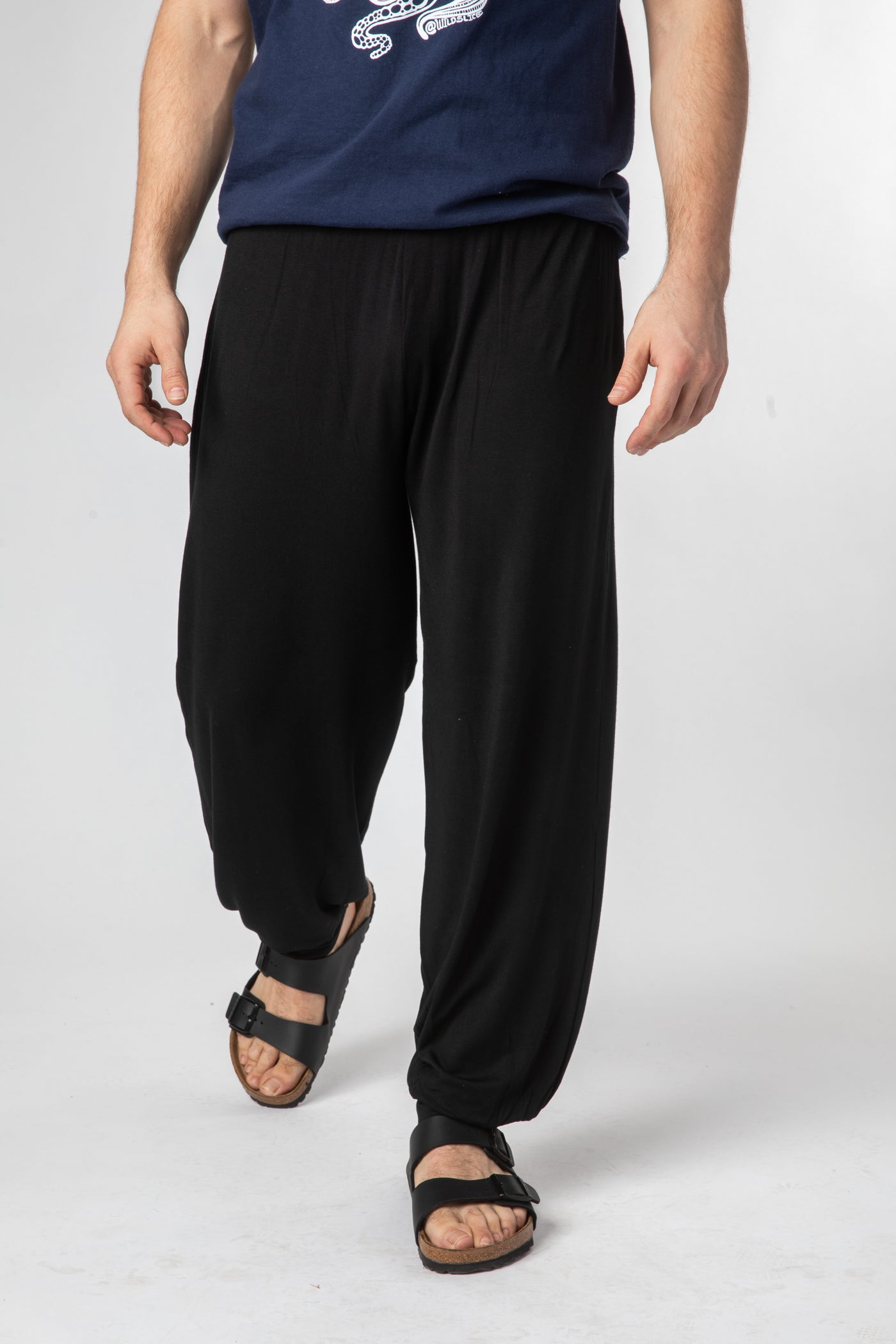 Zachariah is wearing size XL harem pants in black