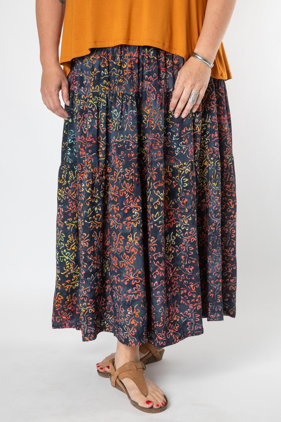 Nicole is wearing size M/L batik prairie skirt in black hidden butterfly