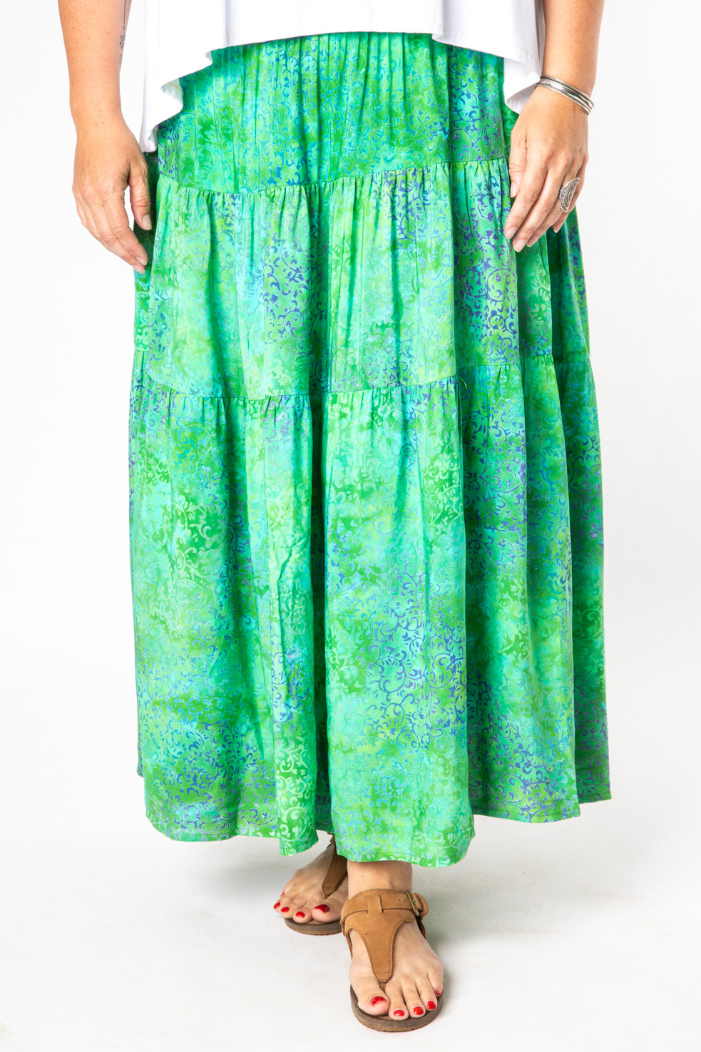 Nicole is wearing size M/L batik prairie skirt in seagreen tendrils