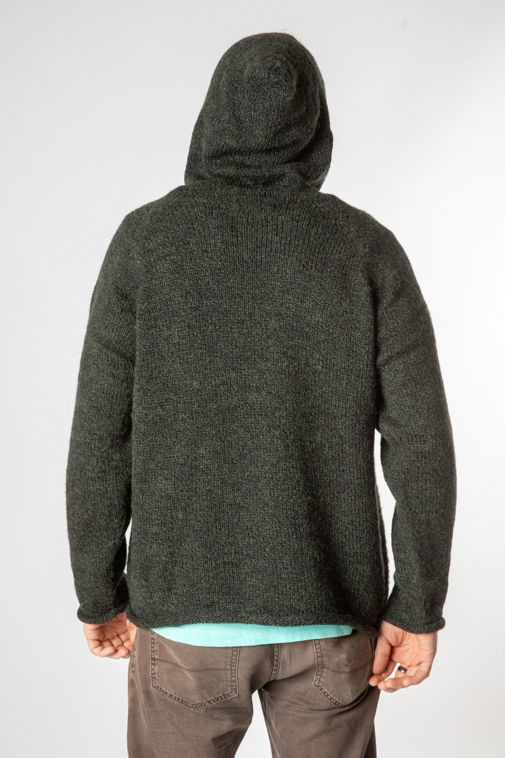 Chauncey is wearing size L alpaca hoodie in dark green