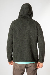 Chauncey is wearing size L alpaca hoodie in dark green
