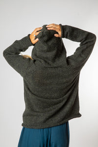 Sophie is wearing size M alpaca hoodie in dark green