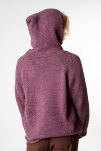 Sophie is wearing size M alpaca hoodie in plum