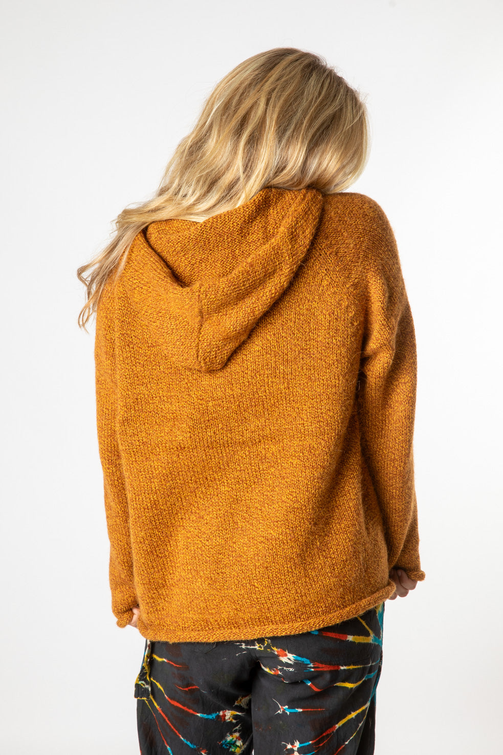Sophie is wearing size M alpaca hoodie in sunflower