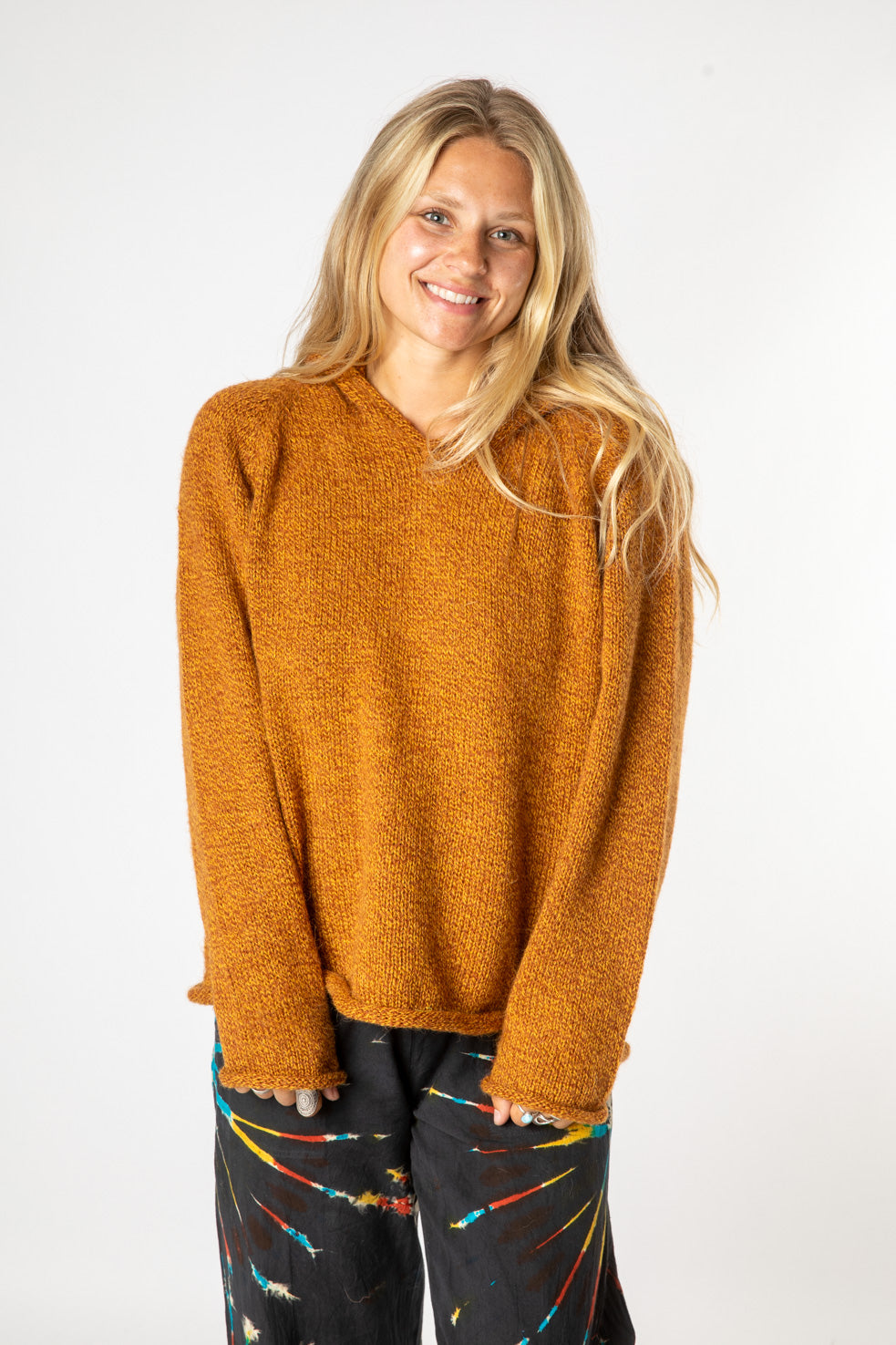 Sophie is wearing size M alpaca hoodie in sunflower