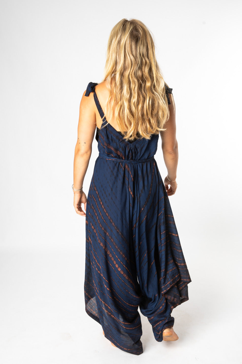 Sophie is wearing a tie dye jumpsuit in blue