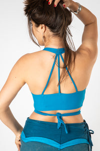 Gabrielle is wearing size S wrap top in blue