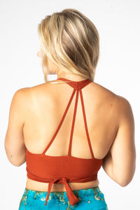 Sophie is wearing size S wrap top in clay