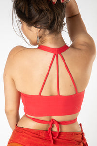 Gabrielle is wearing size S wrap top in coral