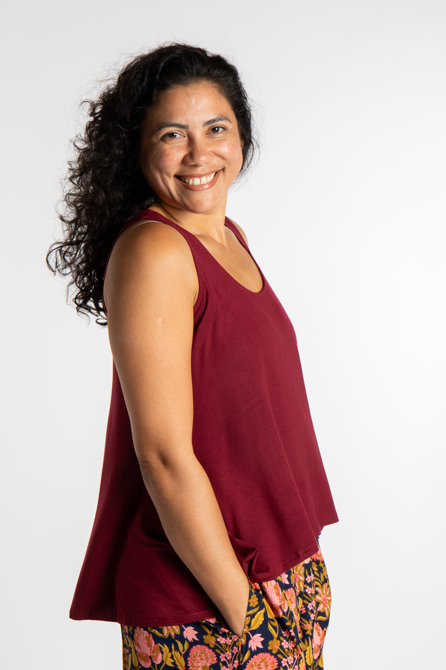 Teciane is wearing this flowy tank top in Burgundy