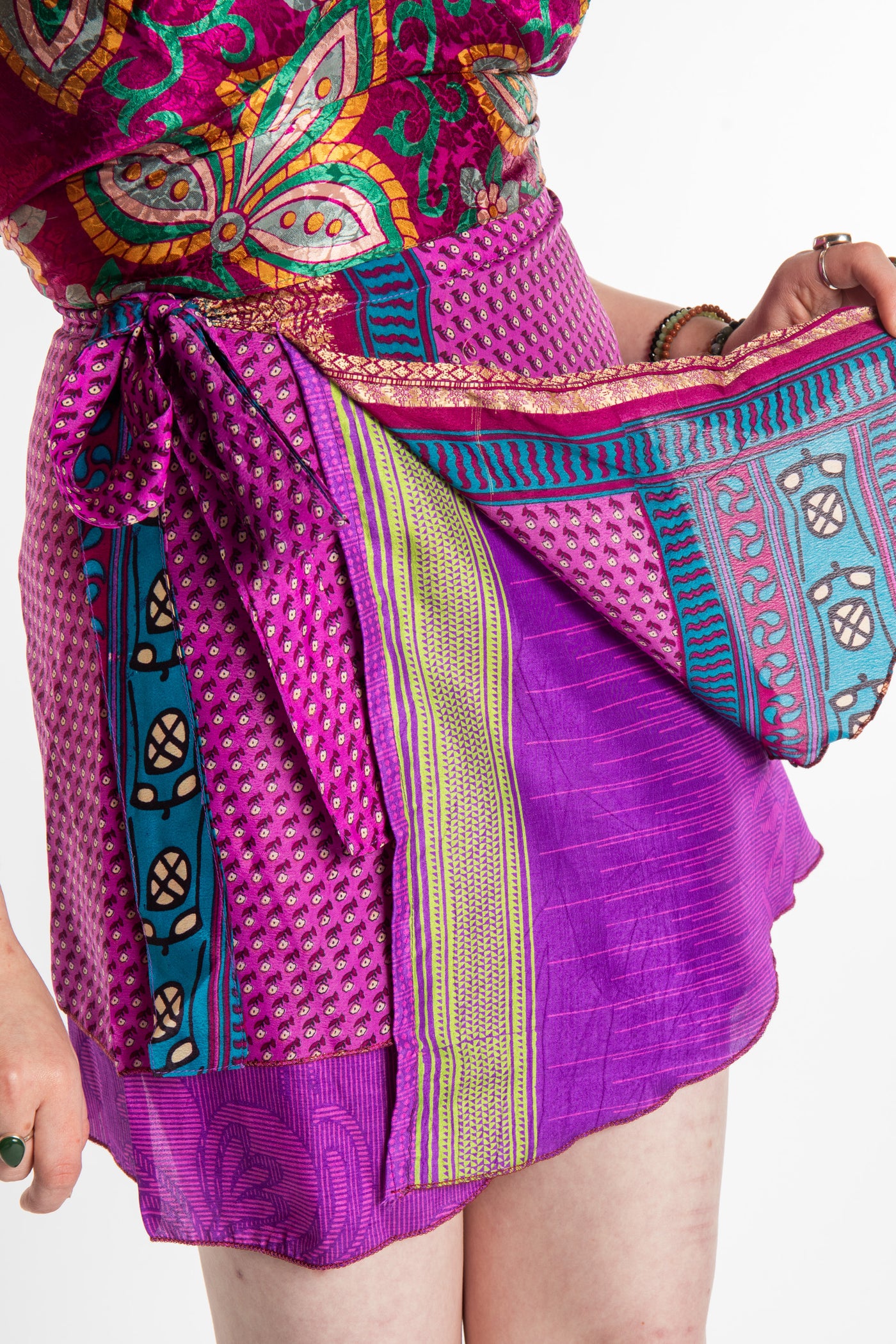 Honora is wearing a silk wrap skirt in Dark Star