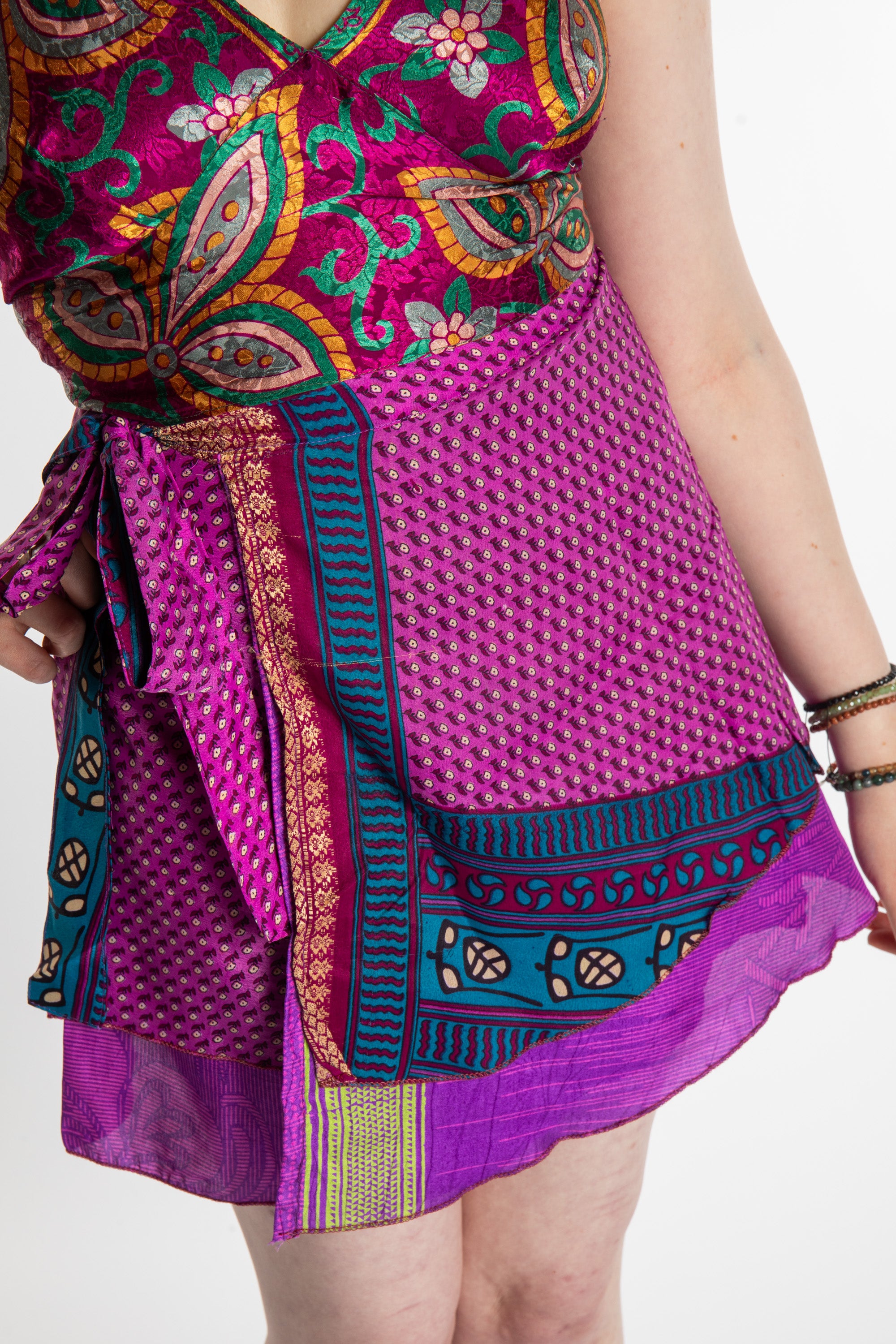 Honora is wearing a silk wrap skirt in Dark Star