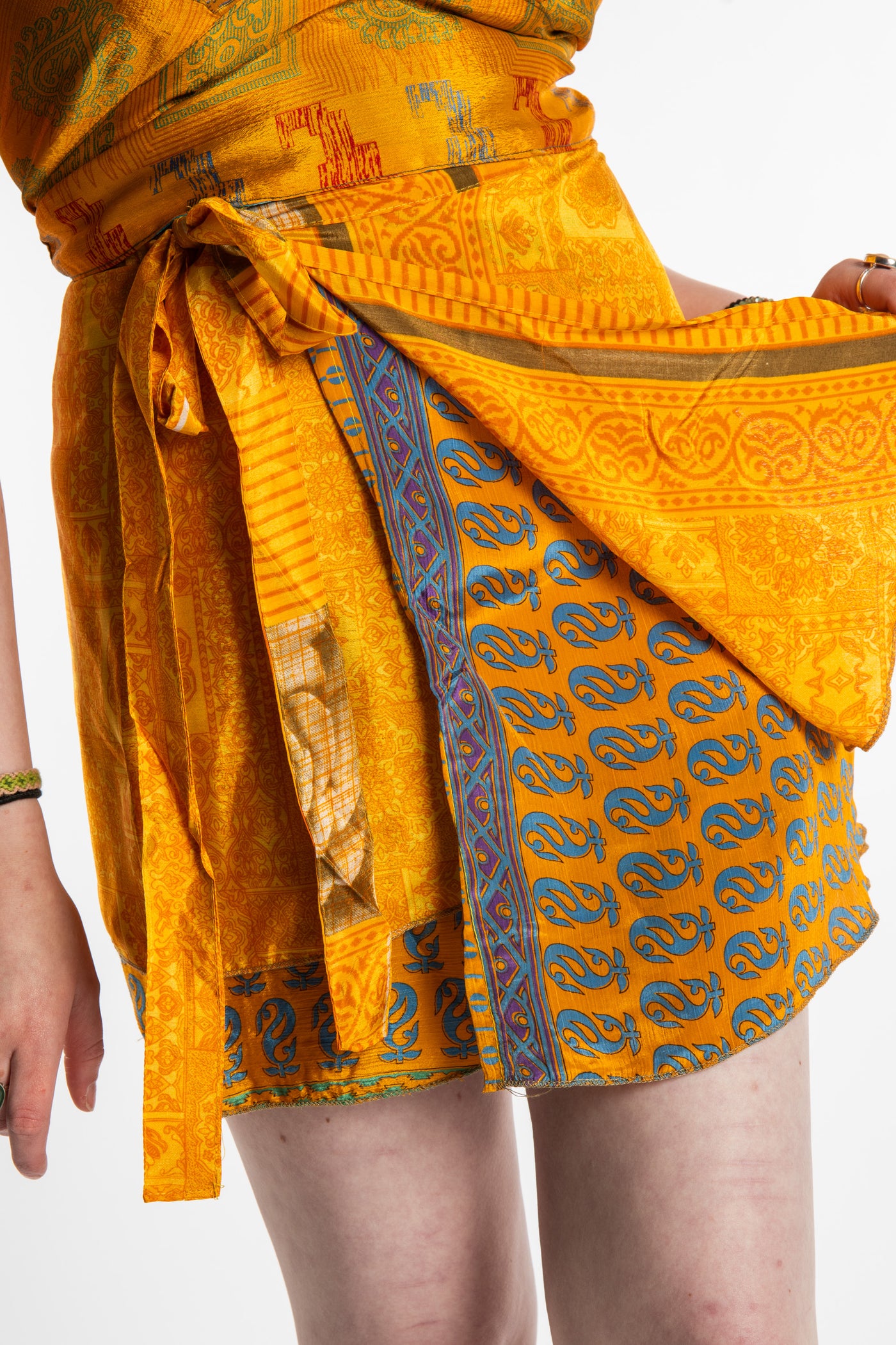 Honora is wearing a silk wrap skirt in Fire on the Mountain