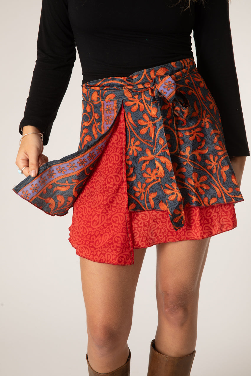 Sophie is wearing a silk wrap skirt in fire on the mountain