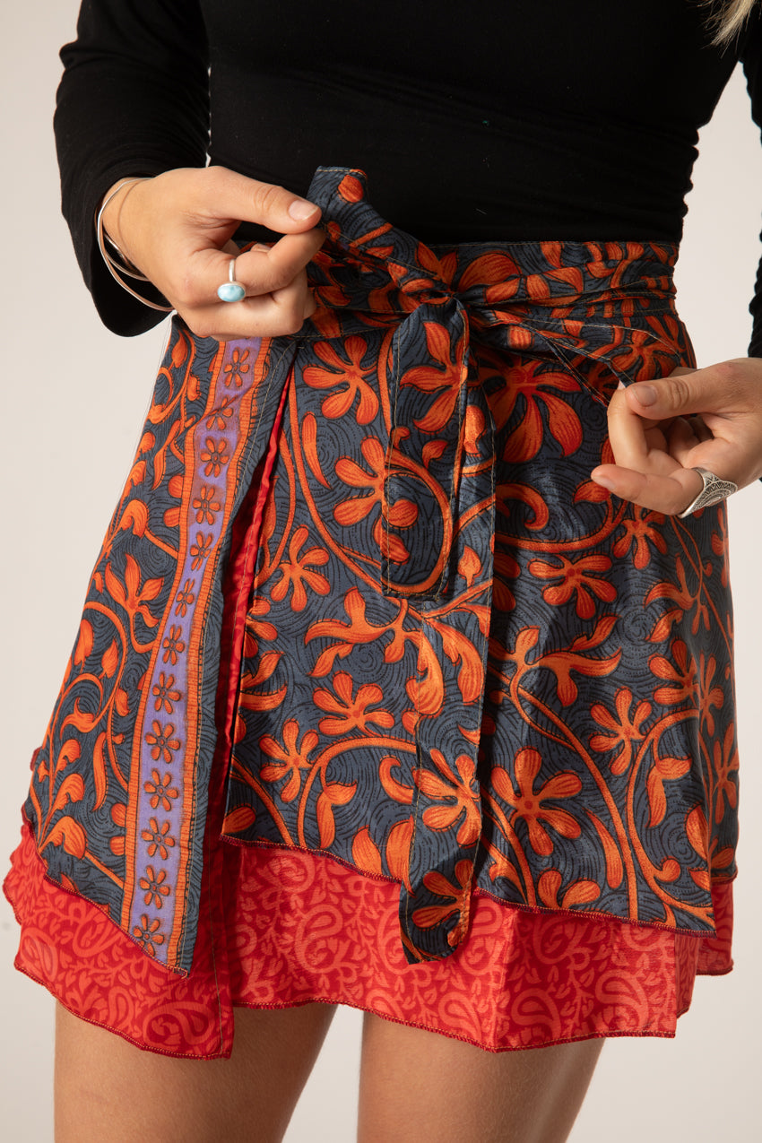 Sophie is wearing a silk wrap skirt in fire on the mountain