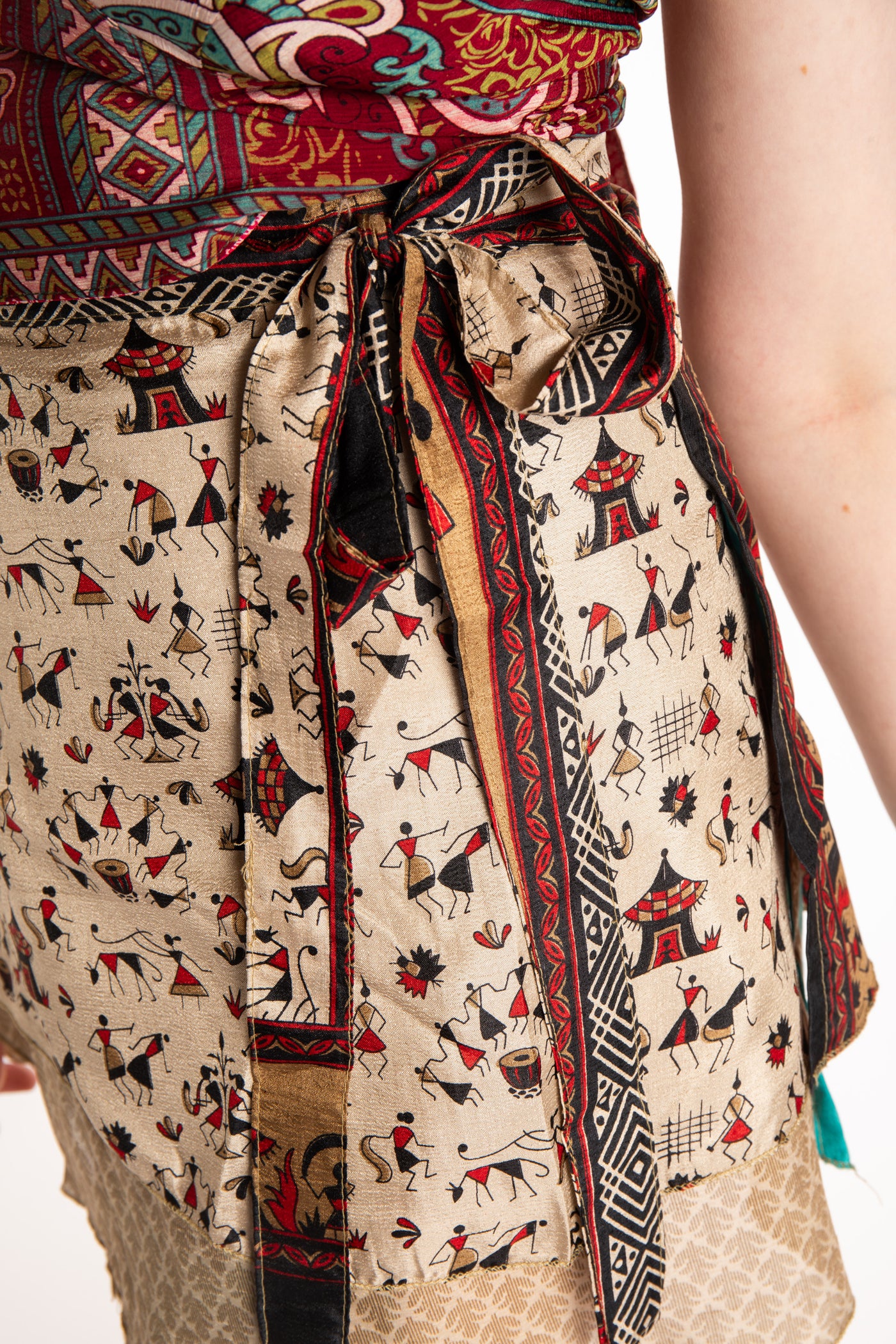 Honora is wearing a silk wrap skirt in Jack Straw