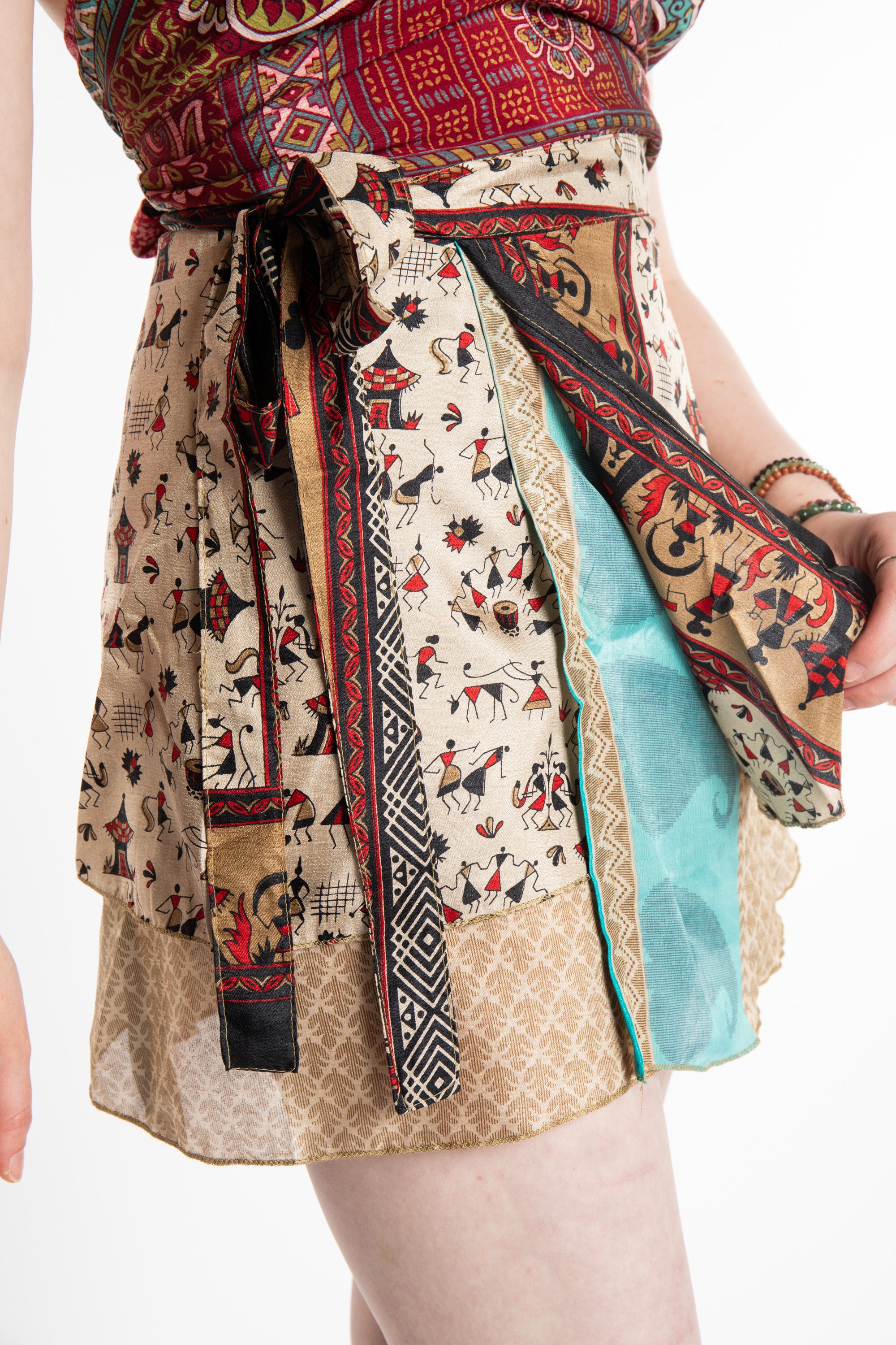 Honora is wearing a silk wrap skirt in Jack Straw