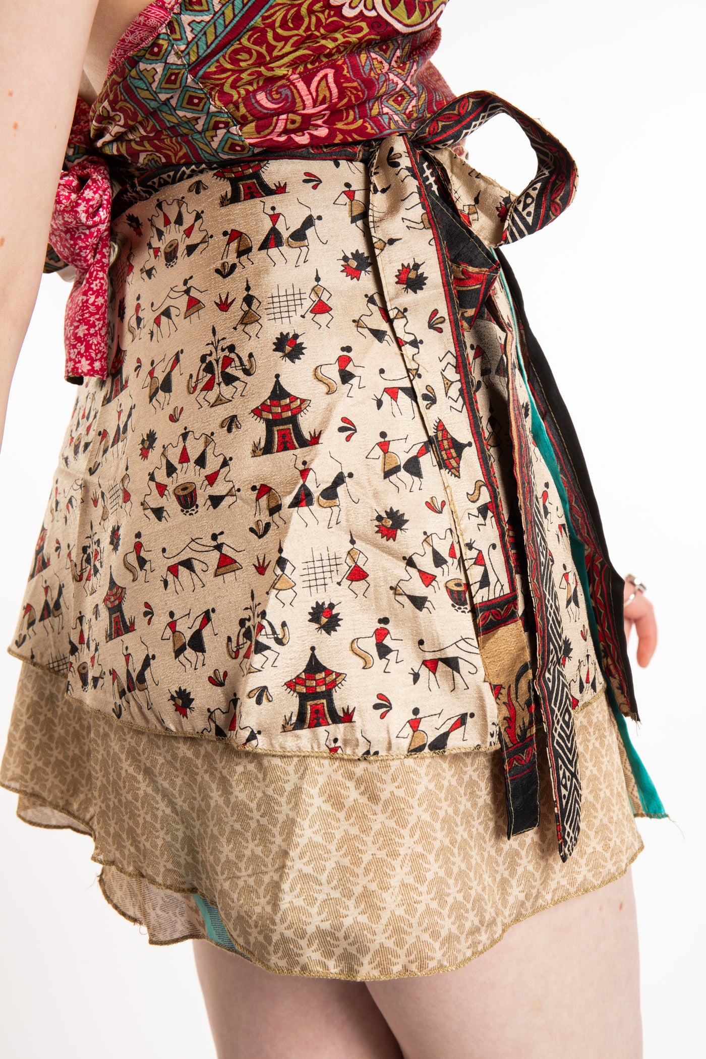 Honora is wearing a silk wrap skirt in Jack Straw