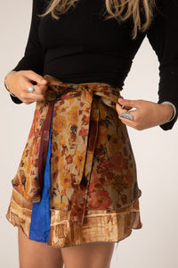 Sophie is wearing a silk wrap skirt in jack straw