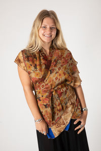 Sophie is wearing a silk wrap skirt in jack straw
