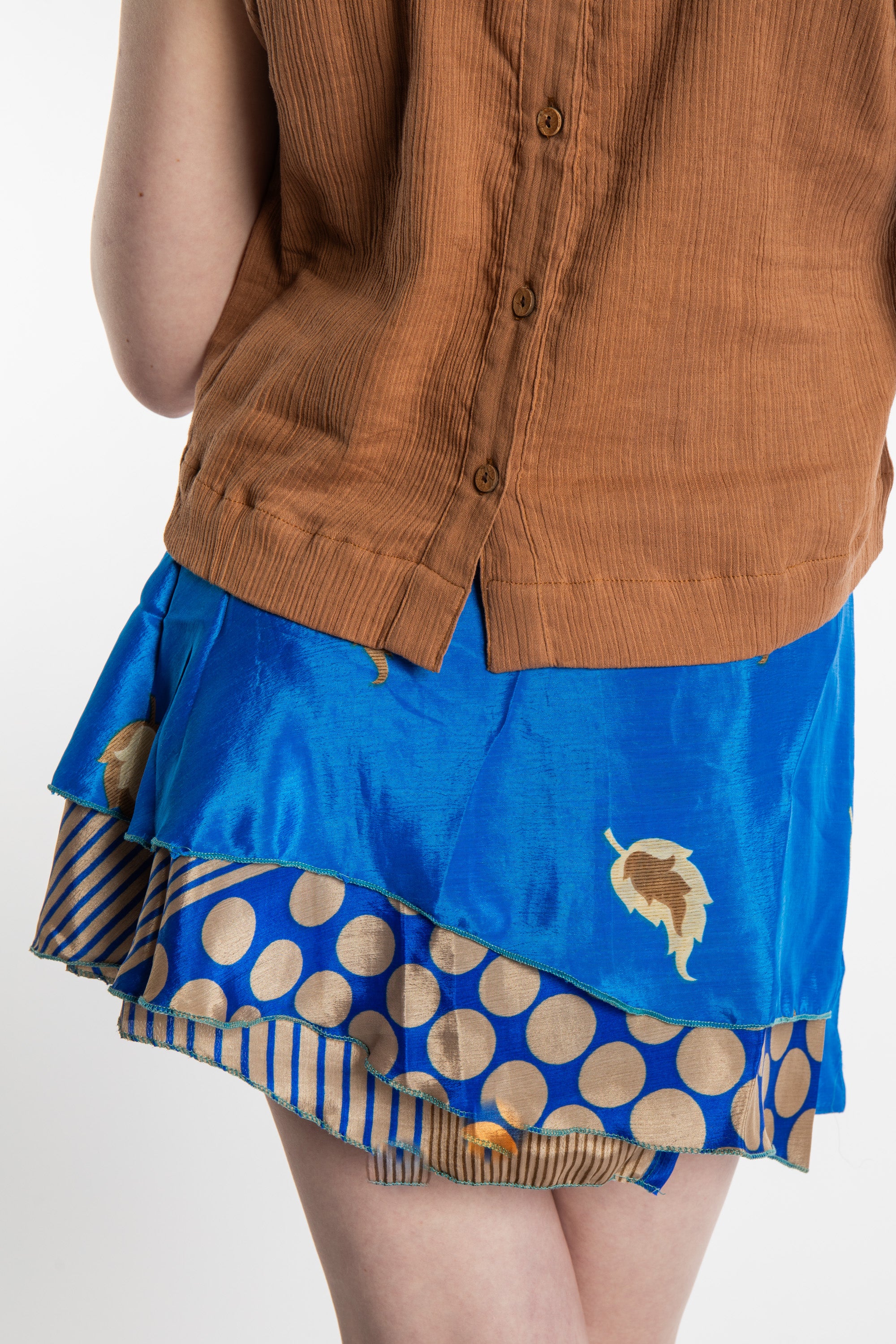 Honora is wearing a silk wrap skirt in Morning Dew
