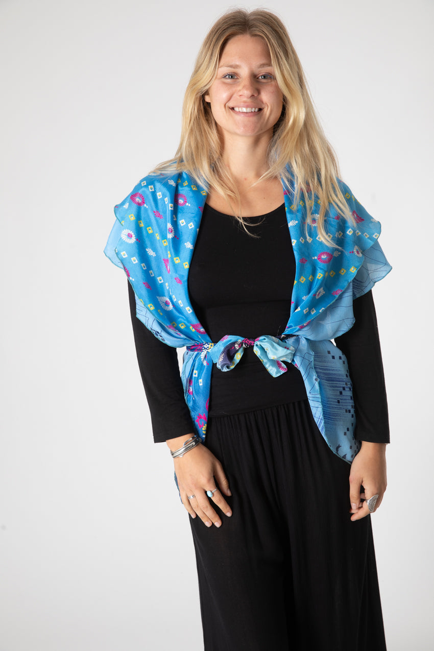 Sophie is wearing a silk wrap skirt in morning dew