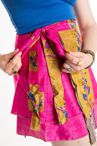 Sophie is wearing a silk wrap skirt in sugar magnolia