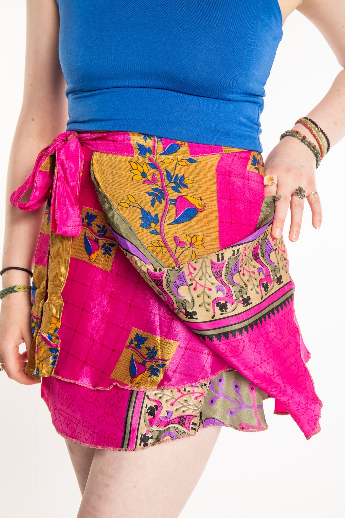 Sophie is wearing a silk wrap skirt in sugar magnolia
