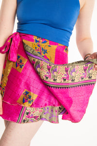 Sophie is wearing a silk wrap skirt in sugar magnolia