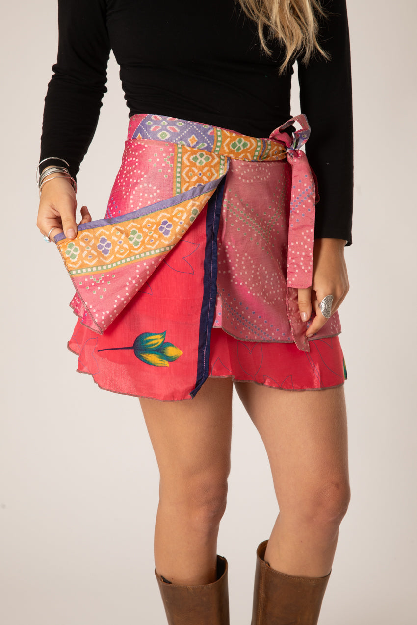 Sophie is wearing a silk wrap skirt in sugar magnolia