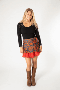 Sophie is wearing a silk wrap skirt in fire on the mountain