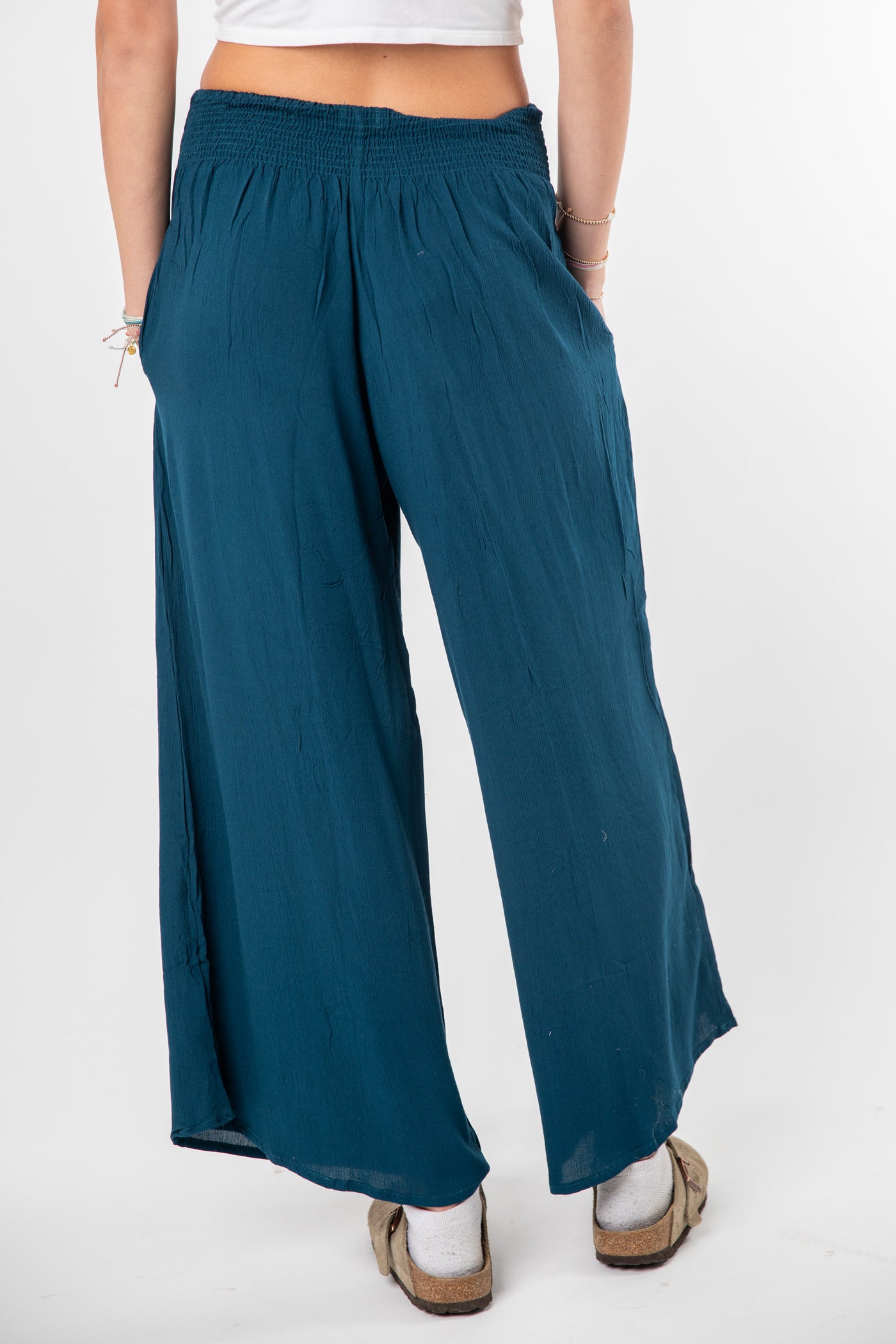 Ember is wearing size S/M wide leg pants in ocean blue