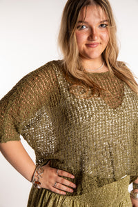 Emma wearing a Olive lightweight knitted poncho