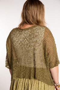 Emma wearing a Olive lightweight knitted poncho