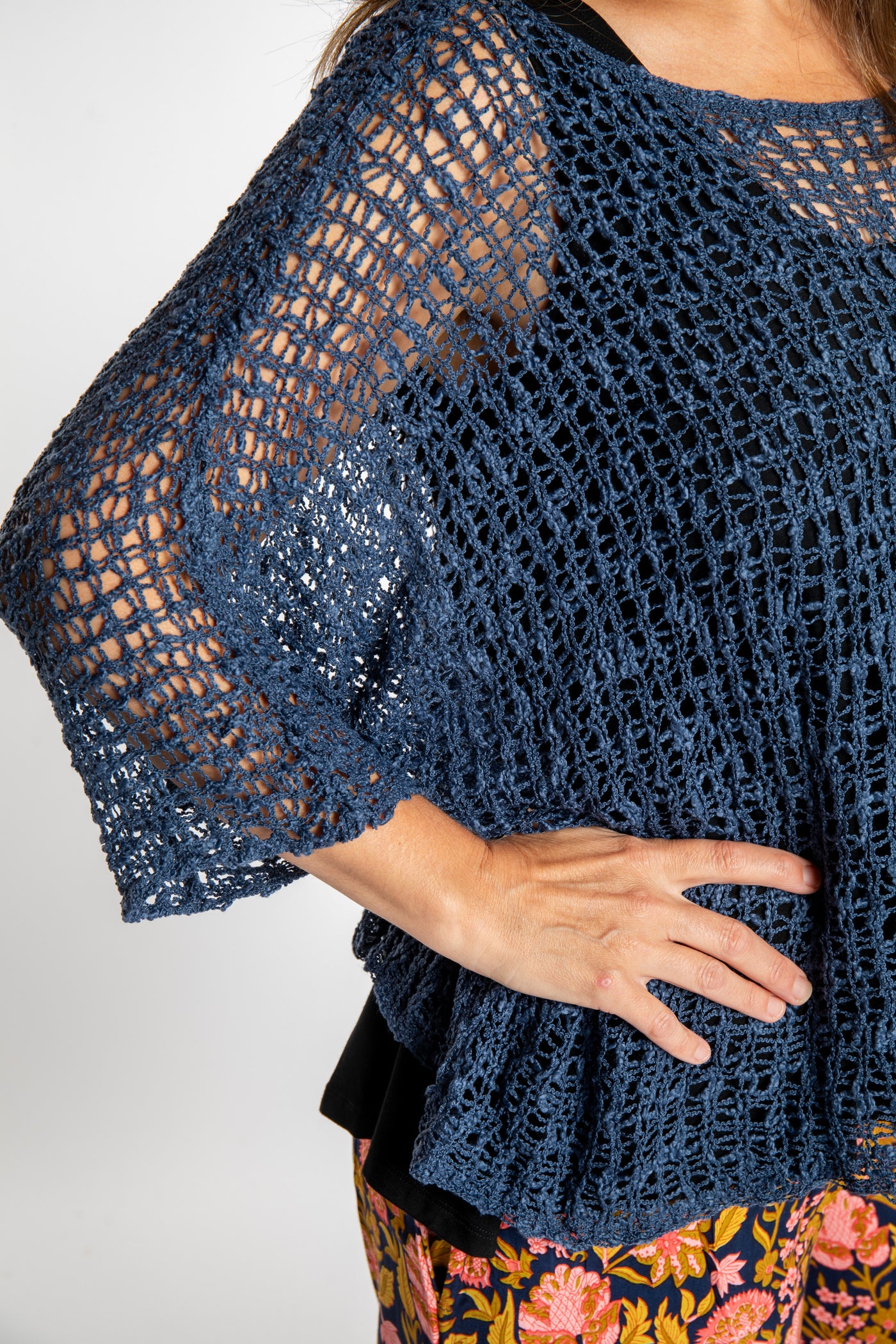 Holly wearing a Pacific Blue lightweight knitted poncho