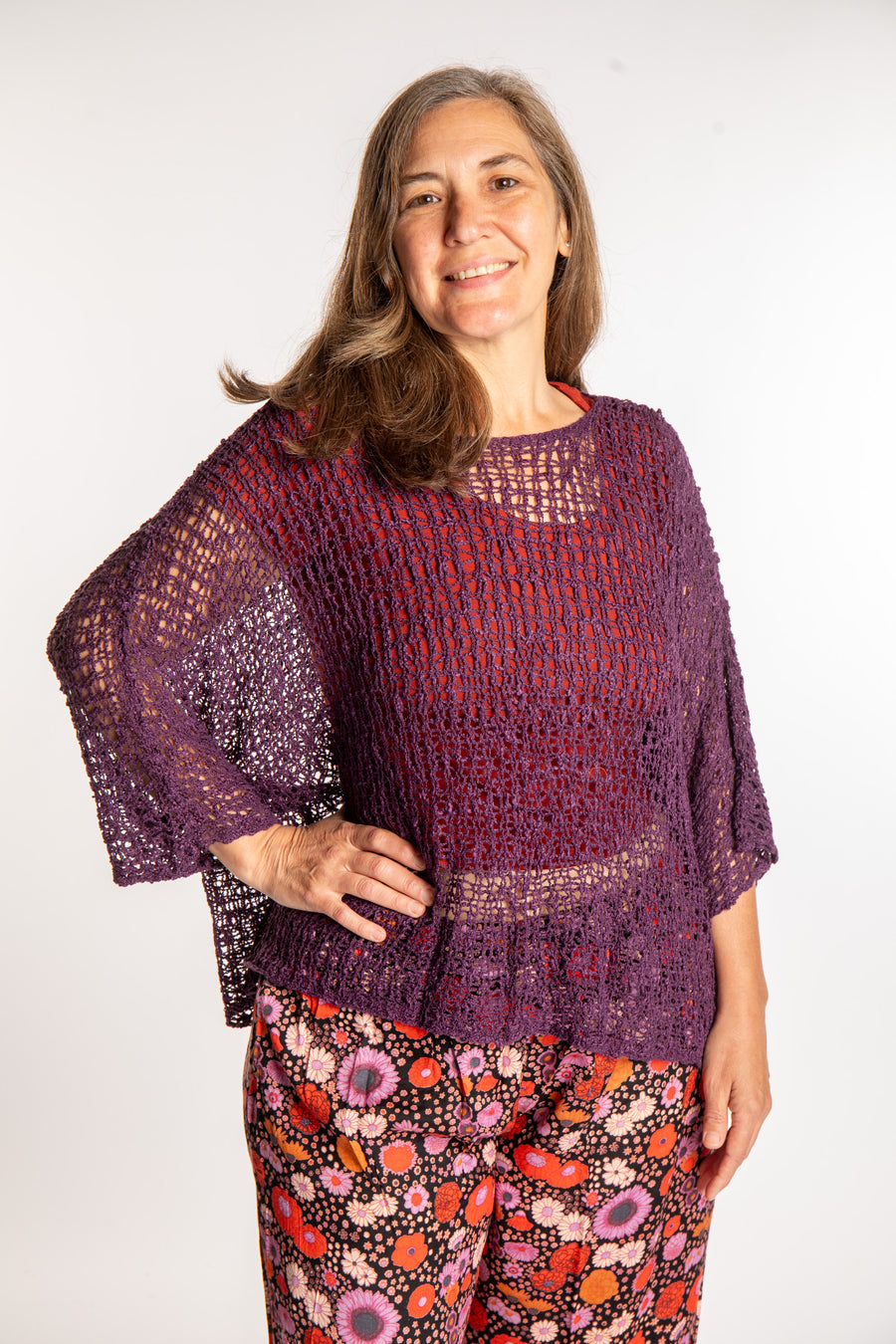 Holly wearing a Purple lightweight knitted poncho