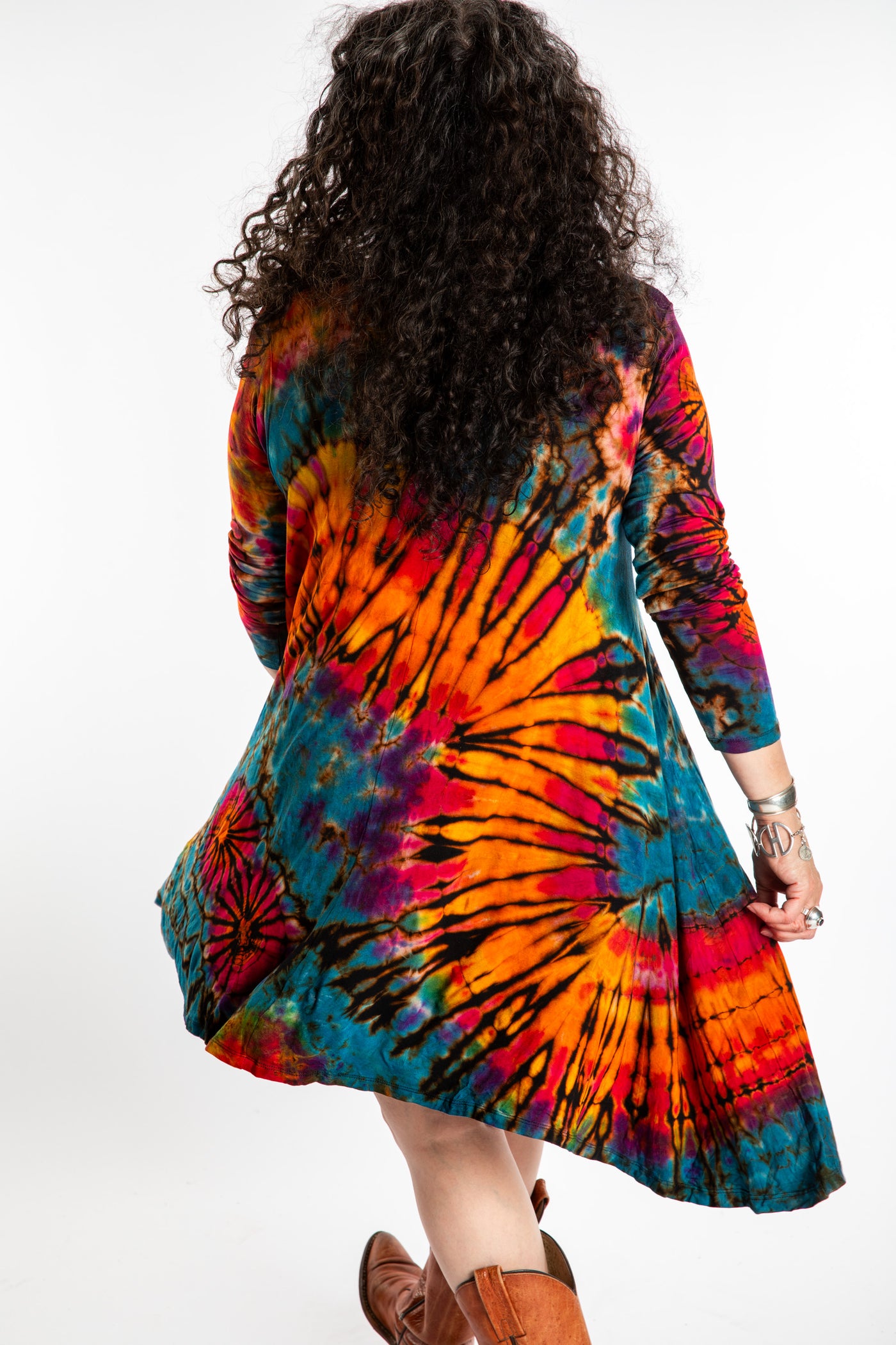 Susan wearing a orange long sleeve tie dye dress in the color Ocean