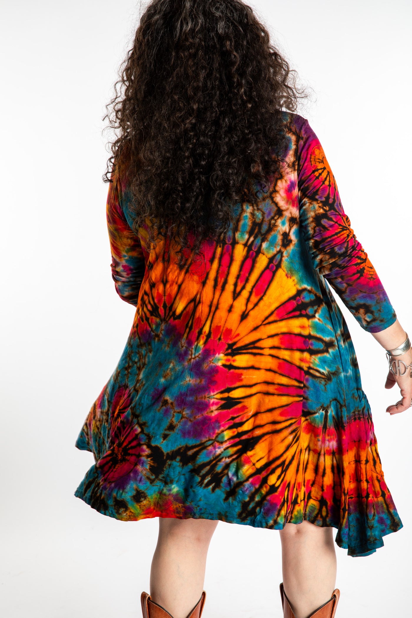 Susan wearing a orange long sleeve tie dye dress in the color Ocean