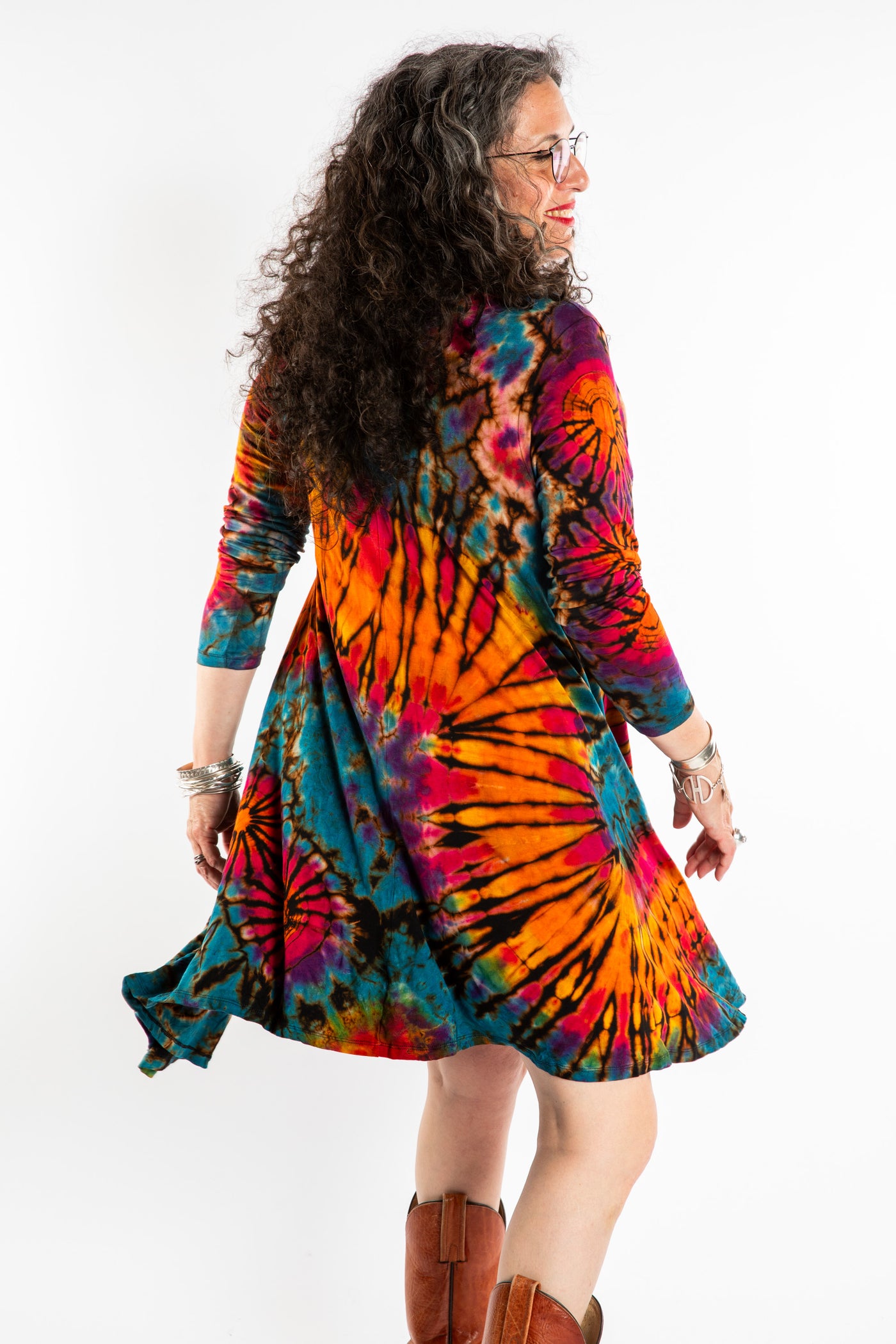 Susan wearing a orange long sleeve tie dye dress in the color Ocean