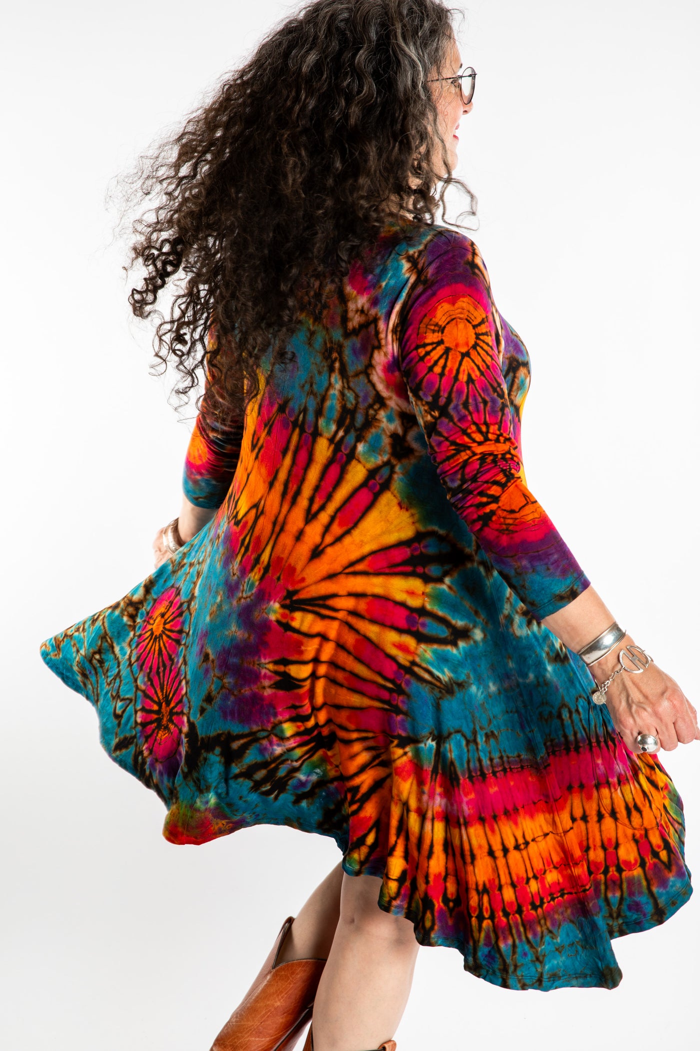 Susan wearing a orange long sleeve tie dye dress in the color Ocean