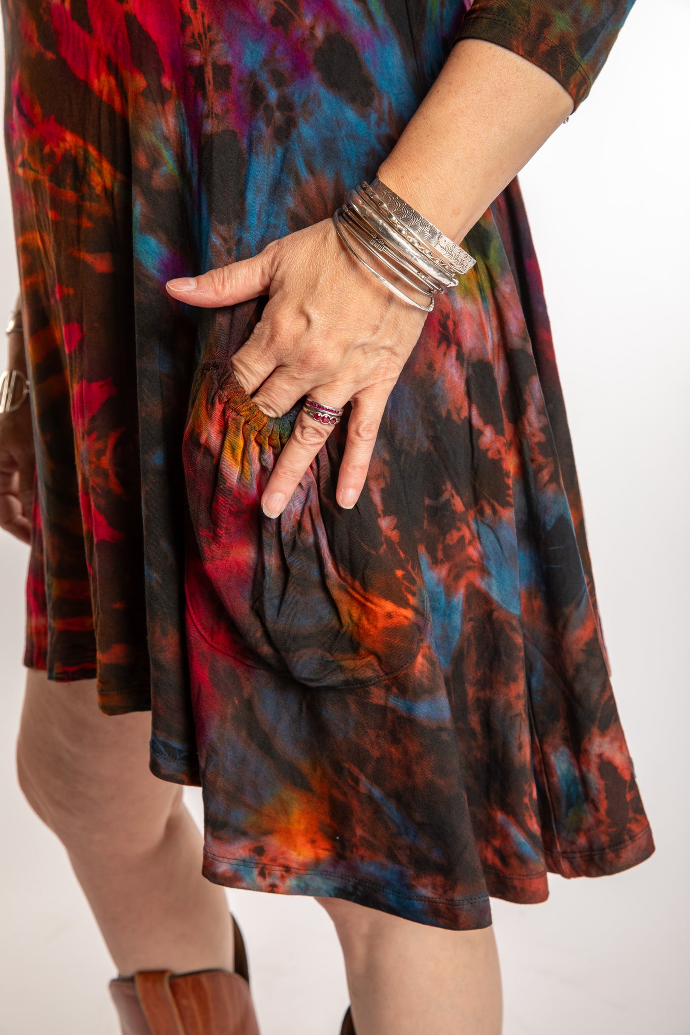 Susan wearing a long sleeve tie dye dress in the color Brown