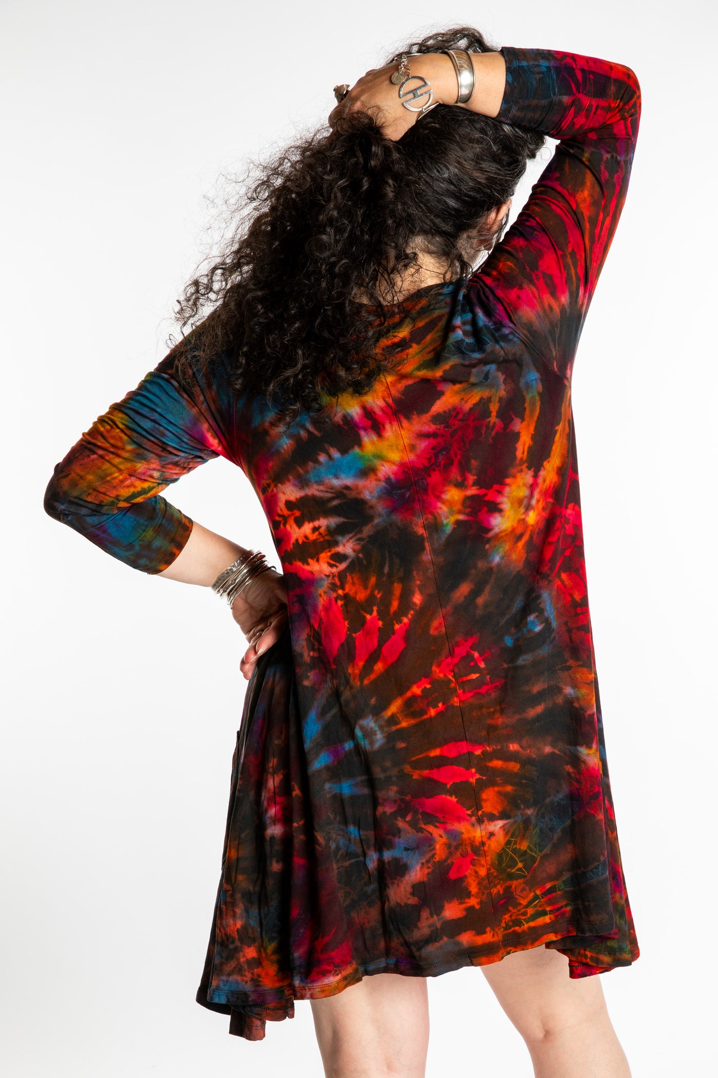Susan wearing a long sleeve tie dye dress in the color Brown